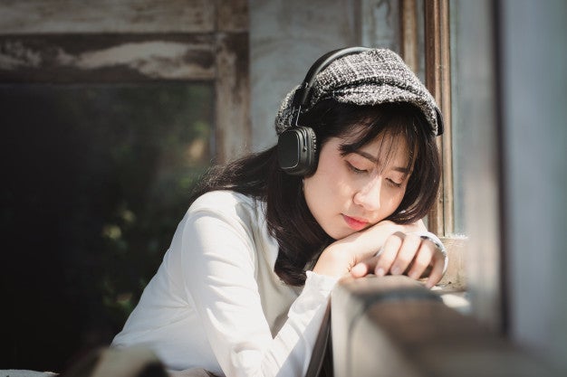 asia woman listening music with lonely 35934 456