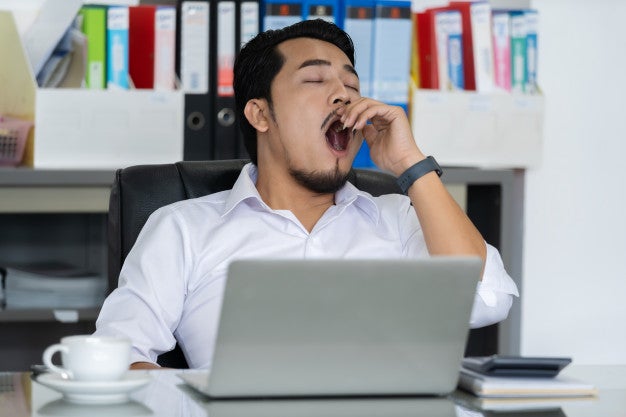tired businessman using laptop yawning 35076 3668