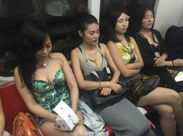 Chinese Models Rides Train With Condoms On Their Face For 'Beauty' - World Of Buzz 2