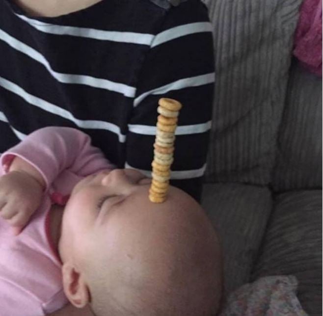 Dads All Around The World Competing Who Can Balance The Most Cheerios On Their Sleeping Todds - World Of Buzz 9