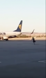 Guy Determined Not To Miss Flight Parkours Over Departure Gate And Runs Across Airport Tarmac - World Of Buzz 4