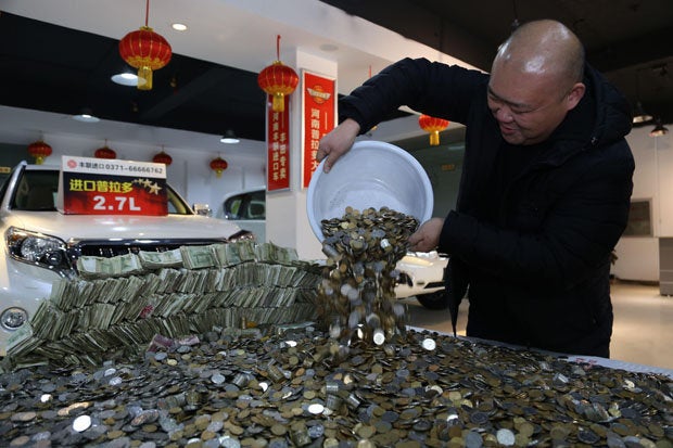 Chinese Man Bought A Car With Huge Piles Of Changes! - World Of Buzz 4