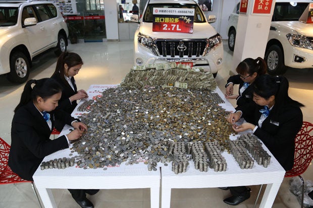 Chinese Man Bought A Car With Huge Piles Of Changes! - World Of Buzz 5