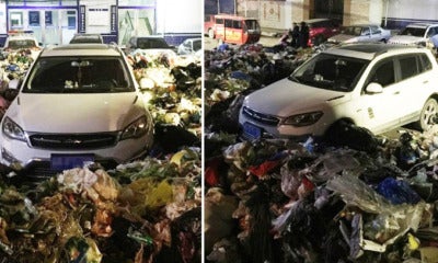 Chinese Man Illegally Parks Car, Comes Back To Find It Buried In 10,000Kg Of Rubbish - World Of Buzz