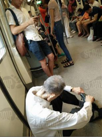 Elderly Man Forced To Sit On Train Floor After No One Offered Him A Seat - World Of Buzz