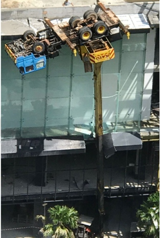 Crane Overturned Hanging On Fourth Floor - World Of Buzz