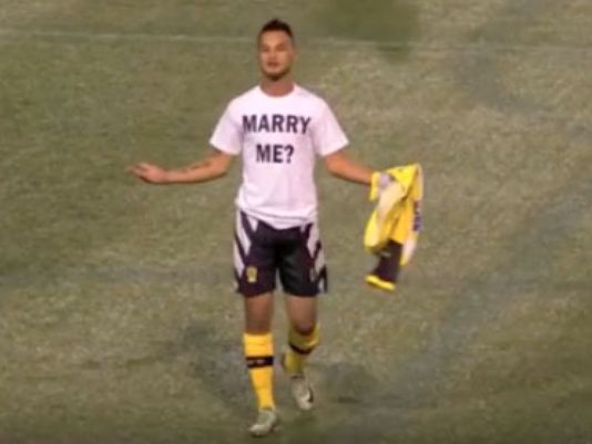 Football Player Who Romantically Proposed To Girlfriend On The Pitch Gets Yellow Card - World Of Buzz 1