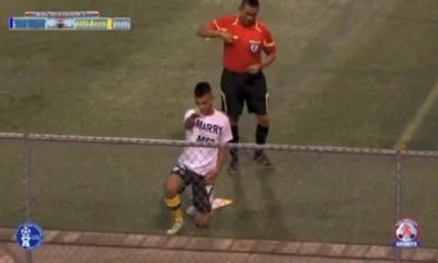 Football Player Who Romantically Proposed To Girlfriend On The Pitch Gets Yellow Card - World Of Buzz
