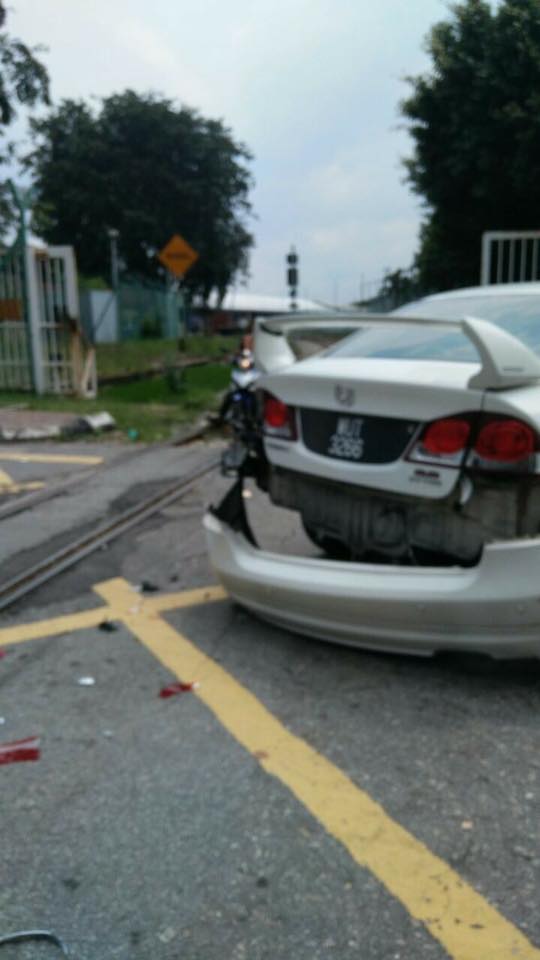 Malaysian Driver Illegally Parks Car Next To Train Tracks, Whole Bumper Gets Torn Off - World Of Buzz 2
