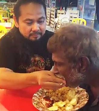 Malay Feeding An Old Barefoot Indian
