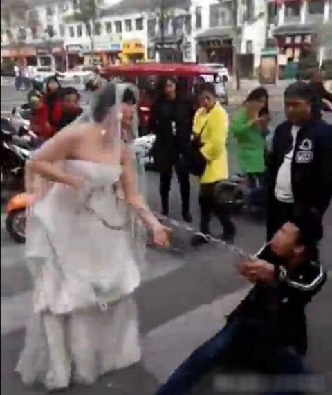 Angry Bride Drags Groom Around Town With Chain When He Didn't Show Up For Wedding - World Of Buzz