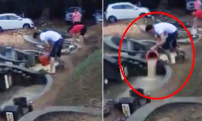 Malaysian Man Caught Dumping Flood Water To The Next Grave During Qing Ming - World Of Buzz 2