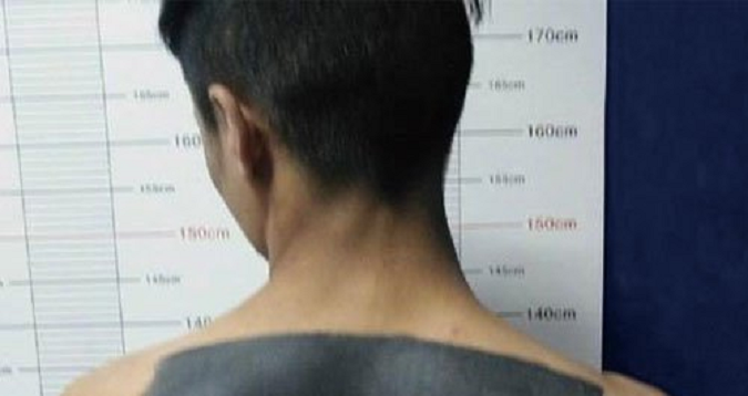Chinese Suspect Taking Mug Shot Hilariously Reveals How He Gets 'Scratch-And-Win' Tattoo - World Of Buzz 1
