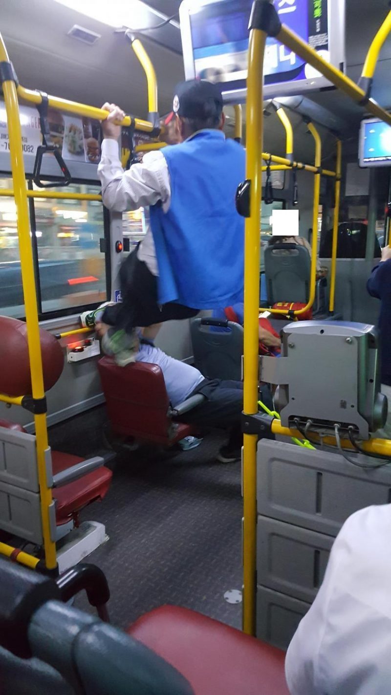 Young Person Sits On Priority Bus Seat, Old Man Kicks Him In The Face - World Of Buzz