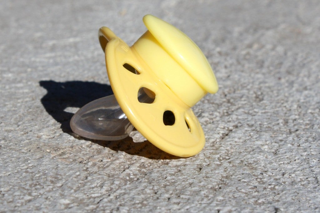 baby pacifier on the sidewalk