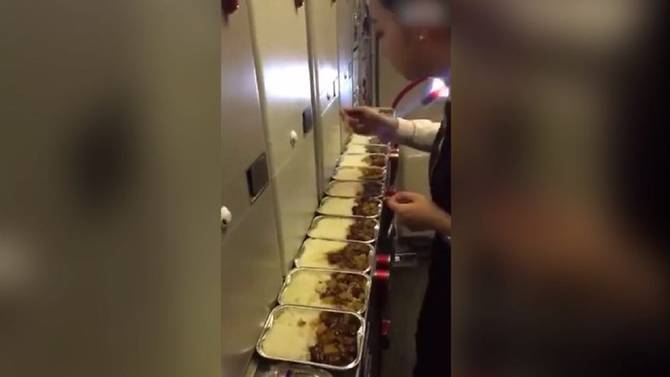 Air Stewardess Caught On Camera Eating Passenger's Leftover Meal, Gets Suspended - World Of Buzz