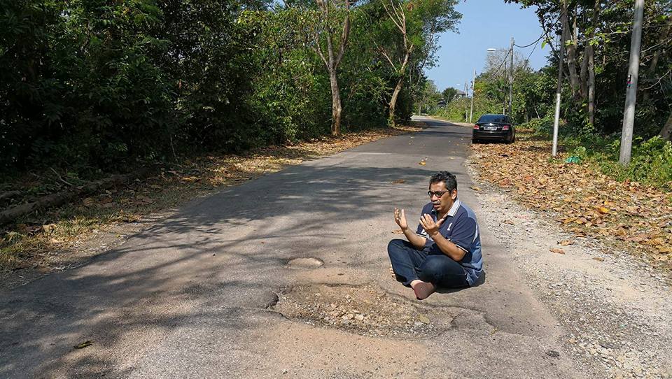 Local Council Finally Fixes Potholes on Road After Photos of MP Praying Go Viral - WORLD OF BUZZ