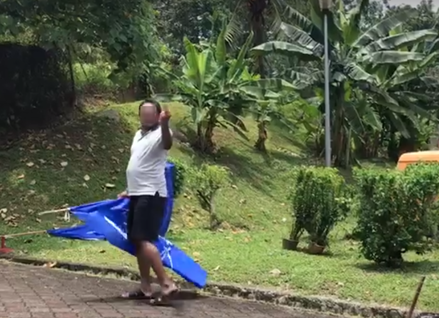 Police are Searching for 'Angry' Man Who Removed BN Flags in TTDI - WORLD OF BUZZ 1