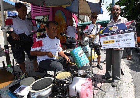 Busking For Hope: Senior Citizens Make Music Out Of Makeshift Instruments - World Of Buzz 2