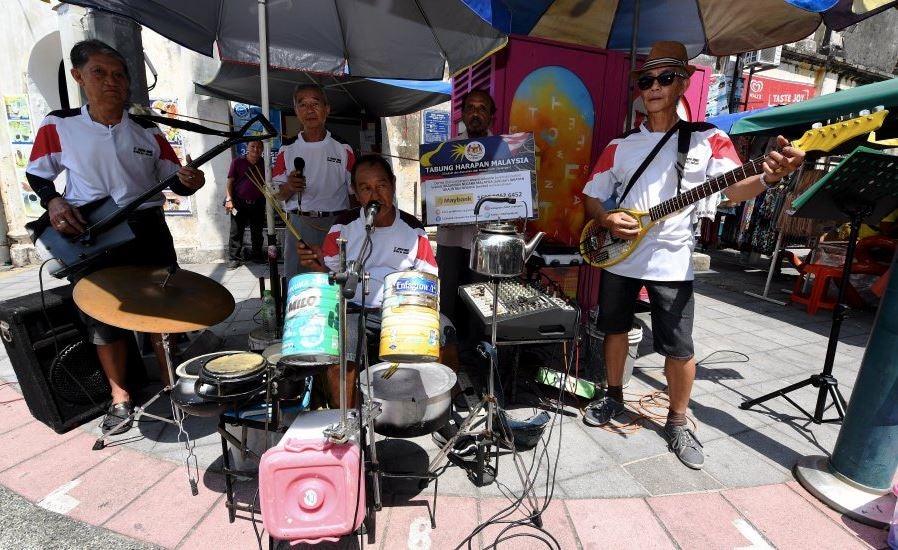 Busking For Hope: Senior Citizens Make Music Out Of Makeshift Instruments - World Of Buzz 3