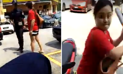 Furious Woman Uses Steering Lock To Attack Dbkl Officers For Clamping Her Car - World Of Buzz 6