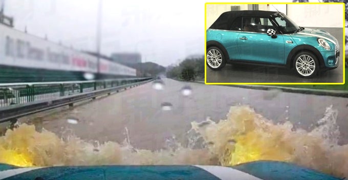 woman wades through water with rm450k mini cooper now needs rm580k for repair world of buzz