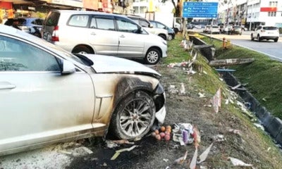 Luxury Car Damaged After Owner Unknowingly Parked  At The Spot Where Joss Paper Was Burning - World Of Buzz