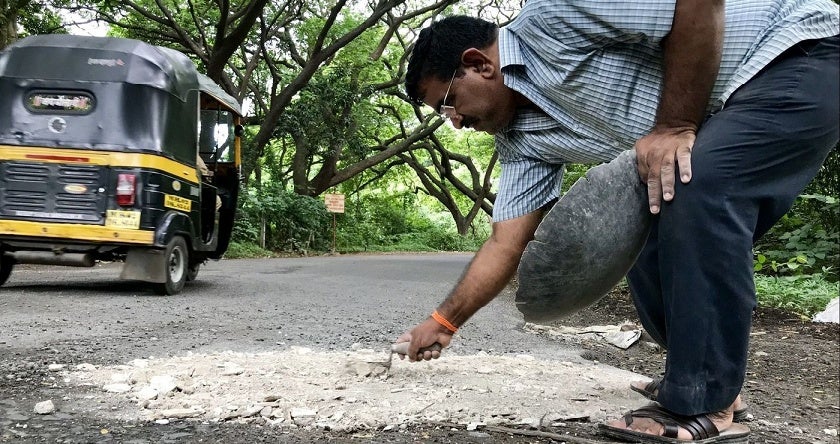 Father Goes Around Filling Up Potholes In Honour Of His Dead Son - World Of Buzz