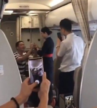 Flight Attendant Gets Fired After Accepting BF's Romantic In-Flight Proposal - WORLD OF BUZZ