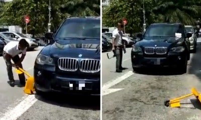 Viral Video Shows Bmw Driver Who Parked Illegally In Taman Desa Destroying Car Clamp - World Of Buzz 4