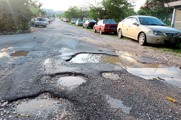 Companies Can Be Fined RM100,000 For Causing Potholes and Damages on Roads - WORLD OF BUZZ