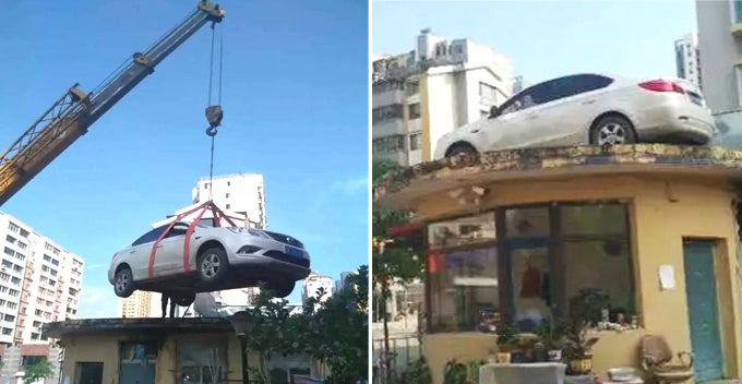 stubborn womans car blocking the entrance crane hired to lift and leave it on roof world of buzz
