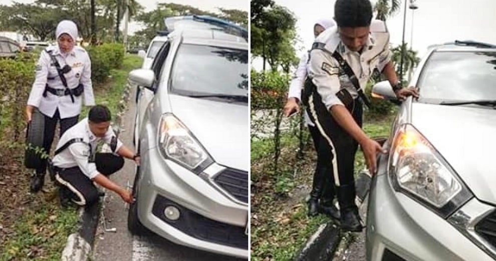 Traffic Police Officers Helped Prevent A Major Jam After Helping Driver Change Tyre - World Of Buzz 1
