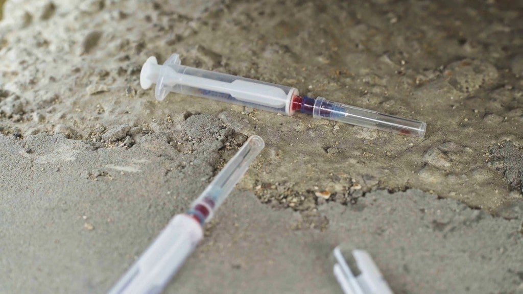 two vials and syringes used by drug addicts are not concrete slab sxymyts0 thumbnail full01