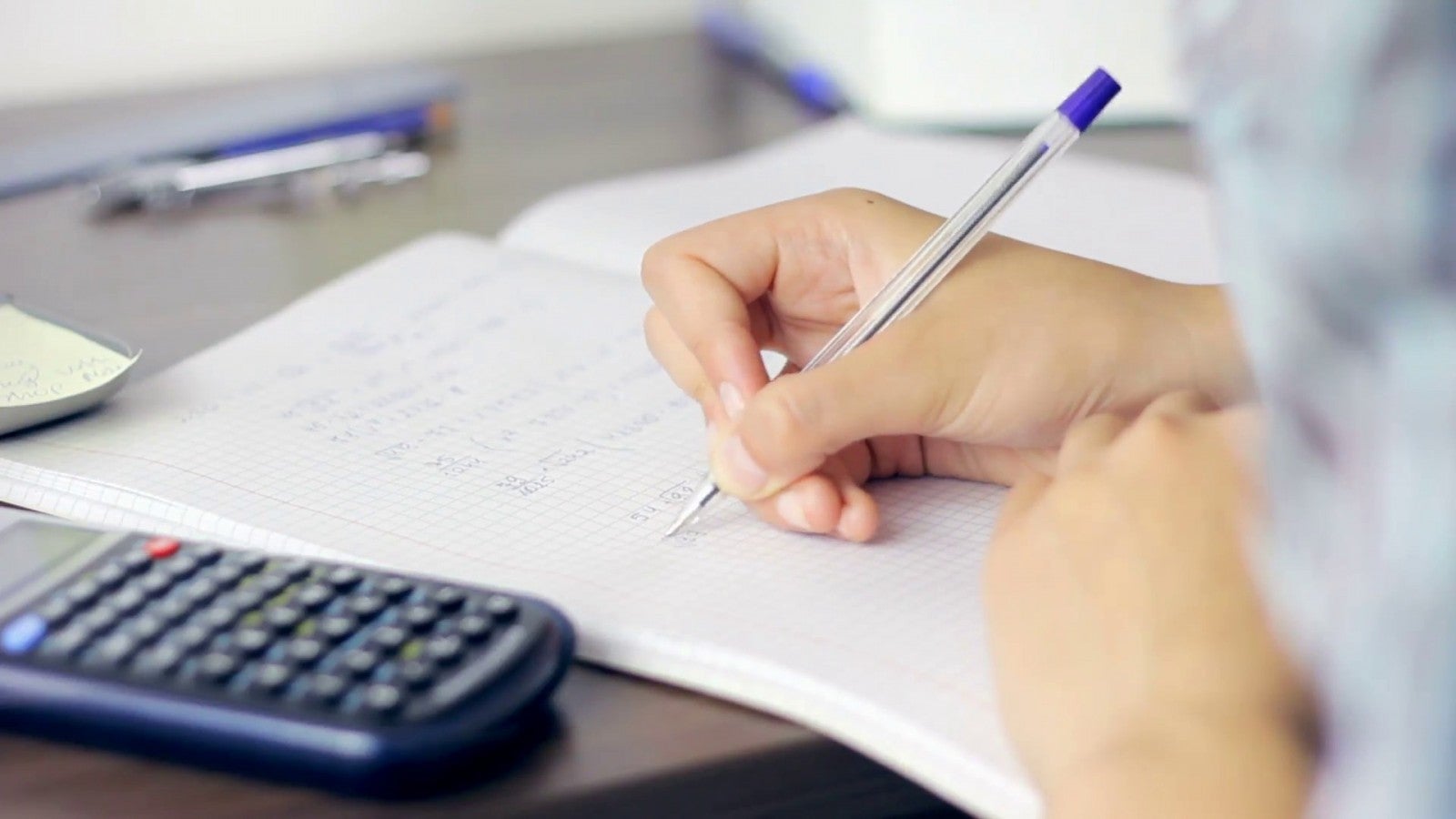 college student doing math homework calculating rjmyssuh F0000