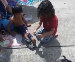 Watch: 2-Year-Old Boy Giving His Shoes To A Homeless Child Will Melt Your Heart - World Of Buzz 3