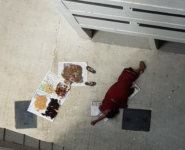 Woman In Red Looked Like She Have Attempted A Suicide, But Turns Out To Be Lying Down Drying Her Food Stuff - WORLD OF BUZZ 1