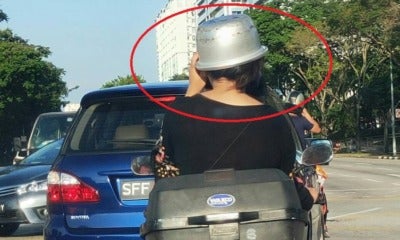 Woman Gets Creative &Amp; Uses Rice Cooker Pot As Helmet While Riding Pillion On Bike - World Of Buzz