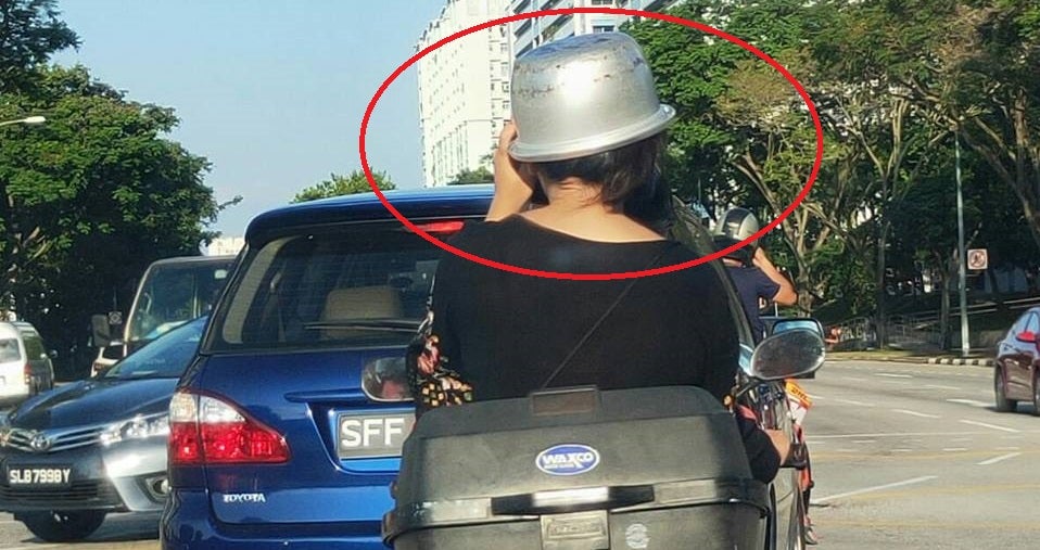 Woman Gets Creative & Uses Rice Cooker Pot as Helmet While Riding Pillion on Bike - WORLD OF BUZZ