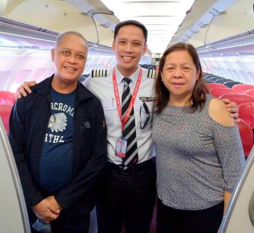 Air Asia Pilot Surprises Parents With Touching Announcement On Their First Flight Together - World Of Buzz 1