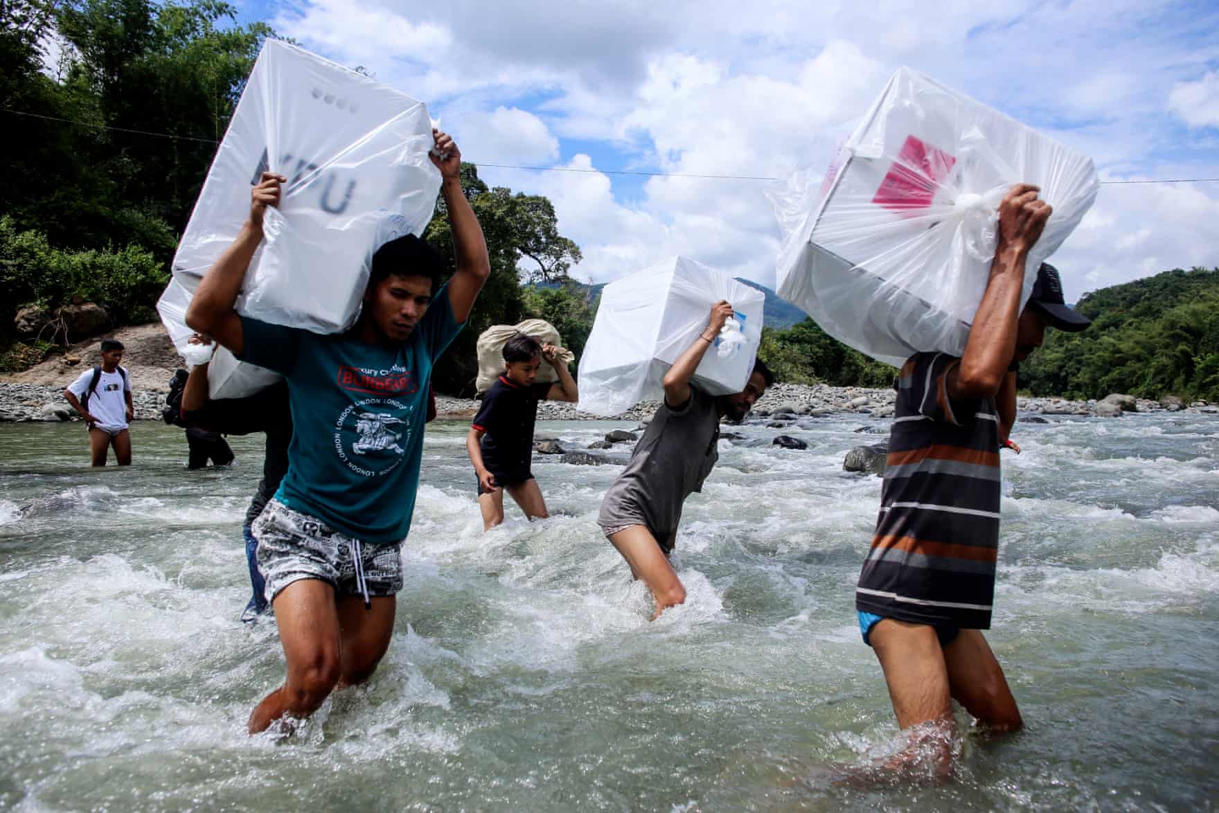 Photos of Indonesian Election Workers Riding Elephants & Crossing Rivers to Deliver Ballot Boxes Go Viral - WORLD OF BUZZ 1