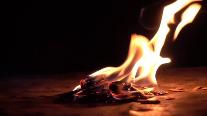 burning wood in the dark small fire against black background 4k close up video rimunjwa thumbnail full01 e1557975888348