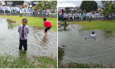 Kid Makes The Rest Of The World Jealous By Swimming In Huge Puddle On His School Field - World Of Buzz