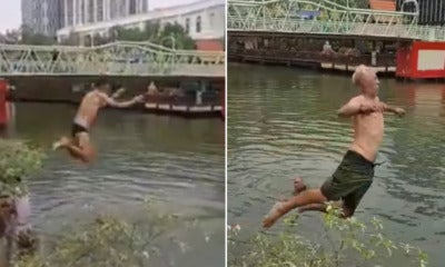 Viral Video Shows Tourists Jumping Into And Swimming At Polluted Melaka River Waterway - World Of Buzz