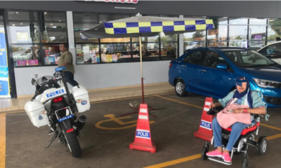 A Traffic Police Motorbike And Tent Obstructing A Disabled Parking Space At An Rnr - World Of Buzz 2