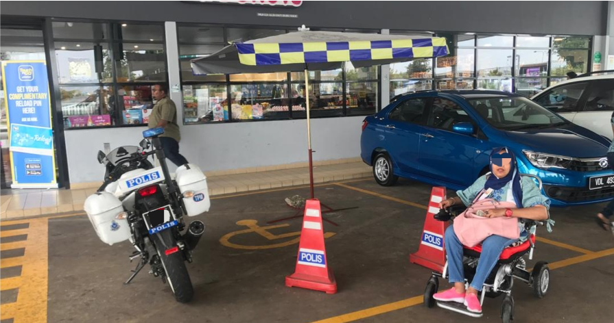A Traffic Police Motorbike And Tent Obstructing A Disabled Parking Space At An Rnr - World Of Buzz 2