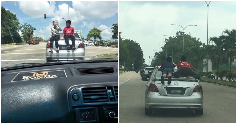 Parenting Fail: Parents Allow Children Ride On The Roof Of Their Car, Runs A Red Light In The Process - World Of Buzz 1
