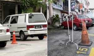 people who illegally chup parking lots with cones can be fined up to rm2000 world of buzz 400x240 1