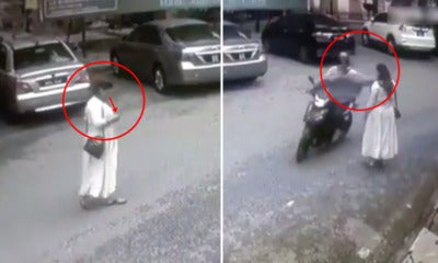 [Video] M'Sian Woman Mindlessly Crossed Road While Looking At Phone, Snatch - World Of Buzz