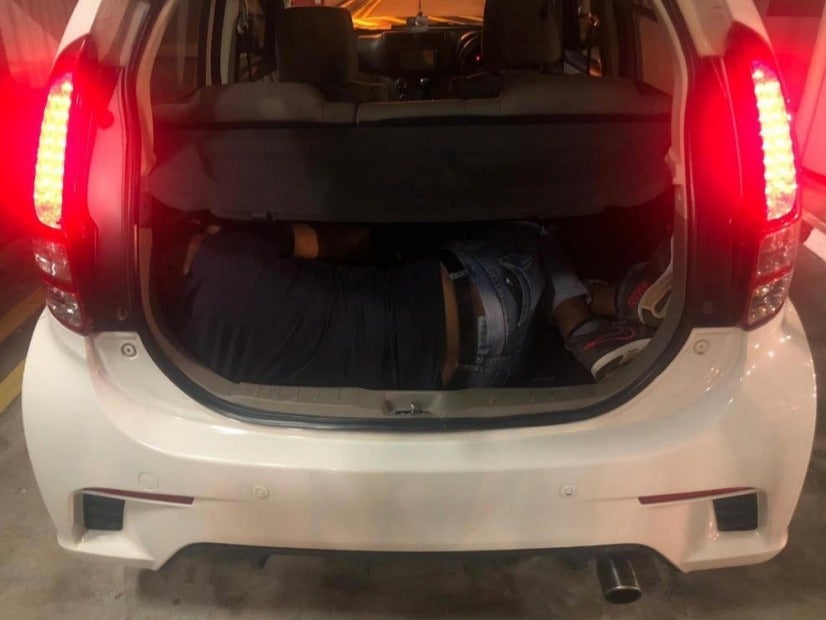 Two Malaysian Women Tries to Smuggle Man Hidden in Myvi Boot Out of Singapore - WORLD OF BUZZ